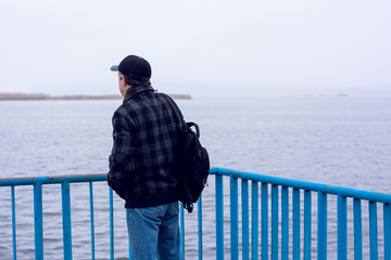 Obraz premium Alone mature man on a island with his thoughts near sea