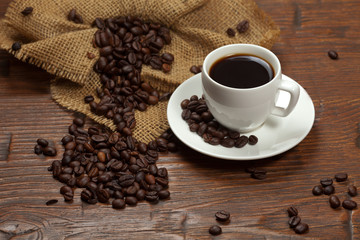 White cup of coffee with beans