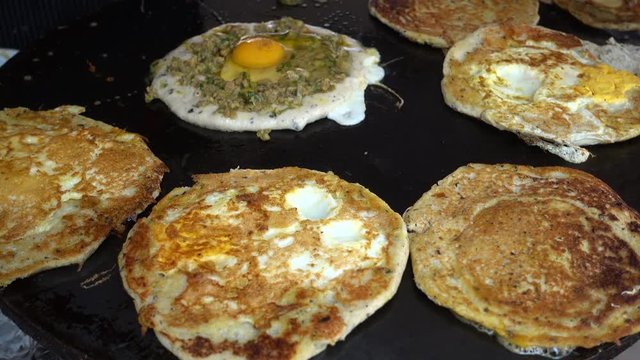 Preparing egg bara, a traditional Newari snack made of black lentil