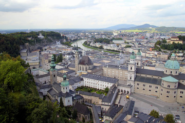 Fototapeta na wymiar Travel to Salzburg, Austria. The view on the city and the embankment of the river.