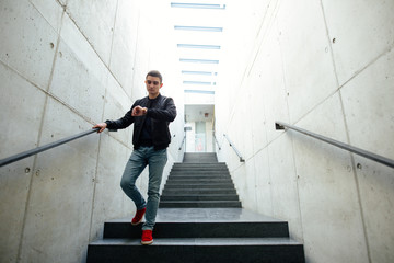 Fashionable man standing outdoors with white background