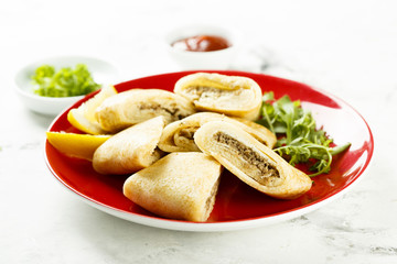 Pancakes, stuffed with meat