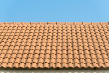 Fototapeta premium Modern tile roof with blue sky