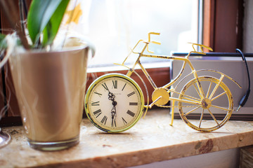 clock and a bike