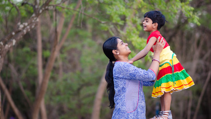 Fototapeta premium Mother and daughter in playful mood