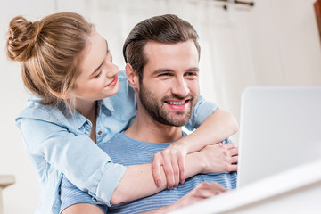 Couple using laptop