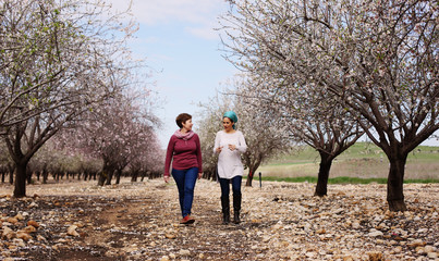 Outdoor portrait of two 45 years old woman