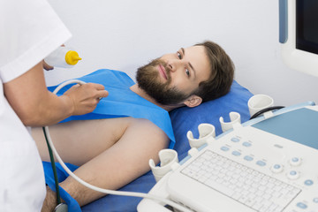 Man Getting Ultrasound Treatment From Doctor