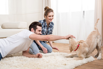 Young couple with puppy