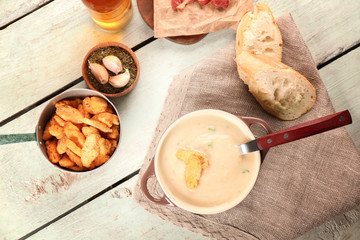 Delicious cream soup on table, top view