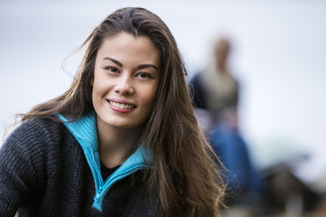 Portrait Of Smiling Young Woman At Campsite