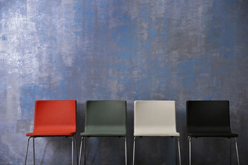 Chairs on grey wall background