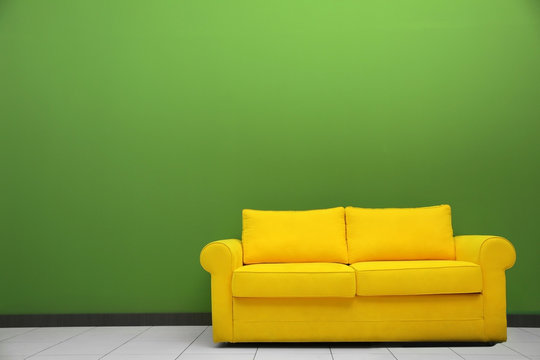 Room Interior With Sofa On Color Wall Background
