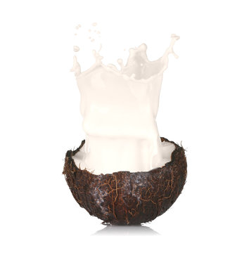 Cracked coconut with splashes of milk on white background