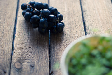 Grapes on a wooden background with paper