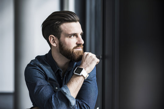 Portrait of a young businessman wearing smart watch