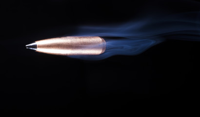 Polymer tipped bullet and smoke