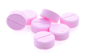 Heap of pills isolated on white background