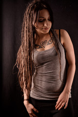 Naklejka premium handsome Girl with Tattoos and Dreadlocks