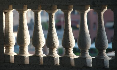 Fototapeta premium Detail of white stone balusters sunlit from one side