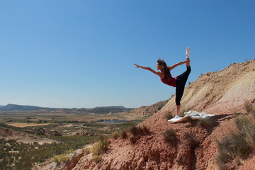 woman doing yoga in the desert