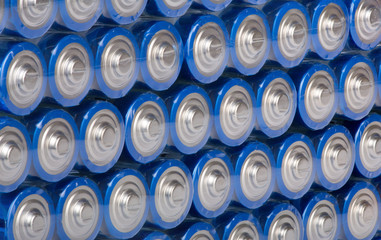 background from rows of blue batteries