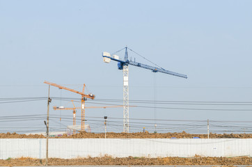 Landscape of construction crane in working place with nature evening light