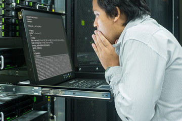 System administrator serious working in data center