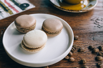 Cup of coffee with macaron from above, flat lay