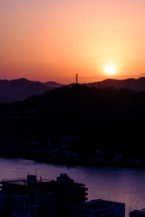 Silhouette of mountains and town at the dawn