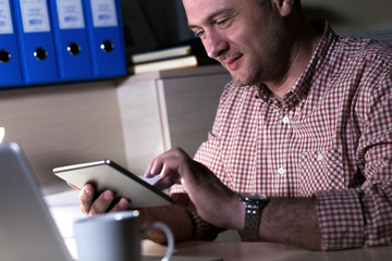 Young businessman working in office.