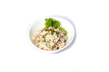 Russian traditional salad Olivier with vegetables and meat. Winter salad