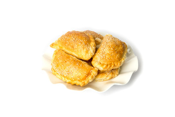 Heap of small chebureks isolated on white background