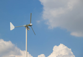 Electric wind turbine with blue sky