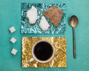 Pieces of coconut and a cup of coffee on stands made of colored 