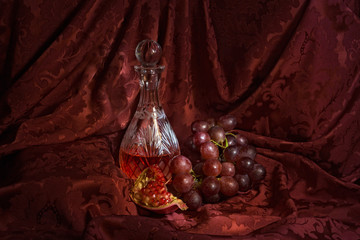 Still life with wine, grapes and pomegranate