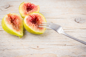 Cut fruit fresh figs on wooden background