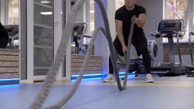 Fit people working out in gym in ultra hd format