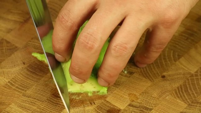 Cut the avocado with a sharp knife