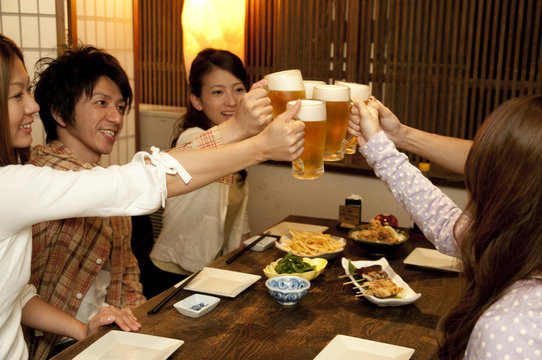 Friends toasting at a bar