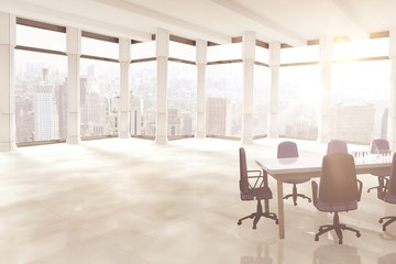 Composite image of empty office chairs and table