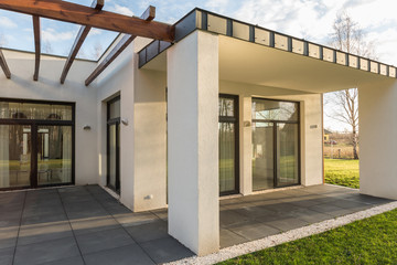 House terrace with pergola and garden