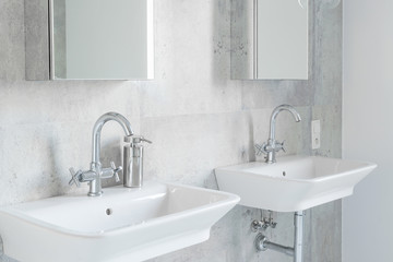 Minimalist modernist bathroom with sinks