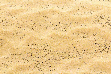 Closeup of sand texture pattern of a beach in the summer