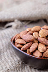 Almonds on sackcloth background