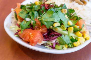 Fresh salad - Delicious fresh salad with tomatoes, lettuce, eggplant, zucchini, cheese, parma ham and olive oil.