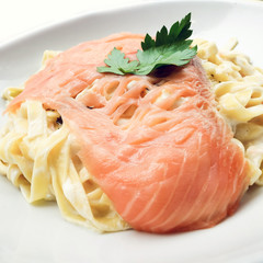 tasty pasta with salmon on a the table