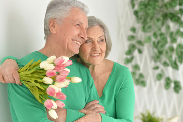 Happy elderly couple embracing