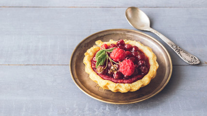  Fresh crisp tartlets filled with jam of raspberries, blueberries, berry pie