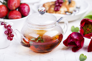 glass teapot with black tea